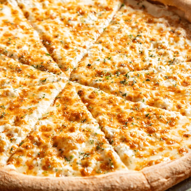 Quattro formaggio pizza slice.