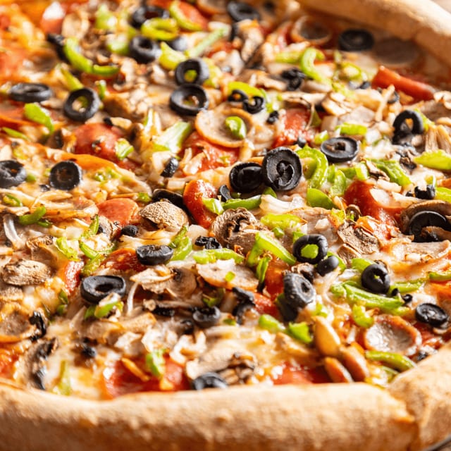 Davie's best deluxe pizza slice.