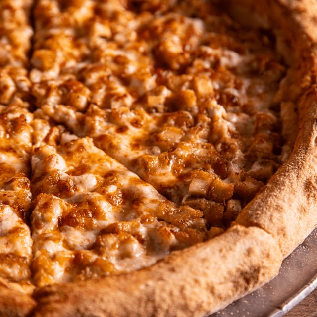 Chicken wing pizza slice.