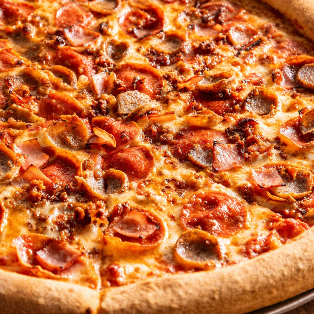 Meat lovers pizza slice.