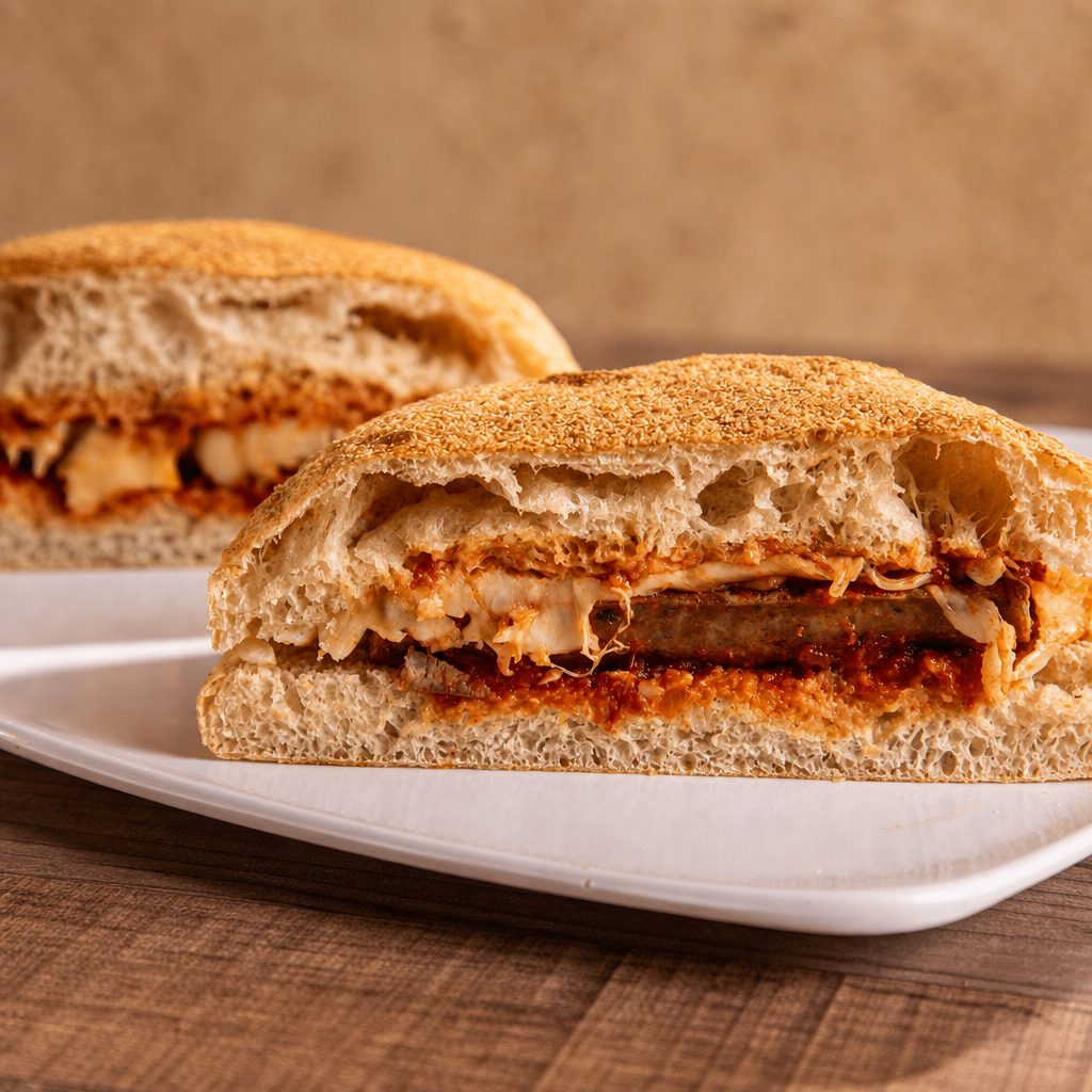 Sausage & Peppers Parmigiana Sandwich.