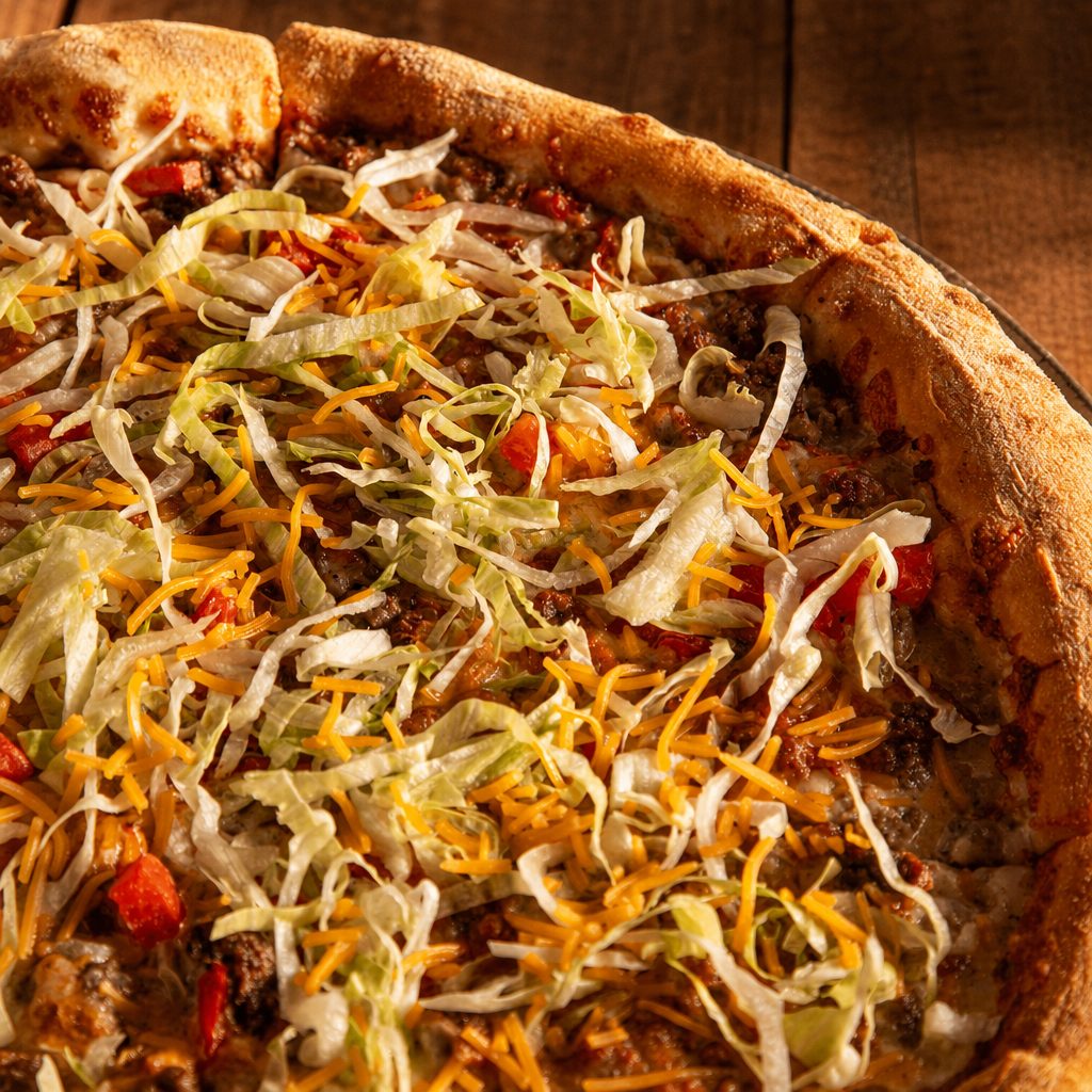 Taco pizza slice.